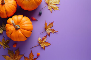 Flat lay with a pumpkins, fall maple leaves and copy space on a purple background. AI generated
