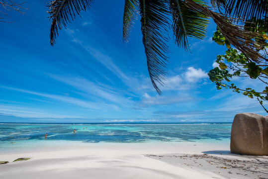 Tropical beach with bathers cooling off