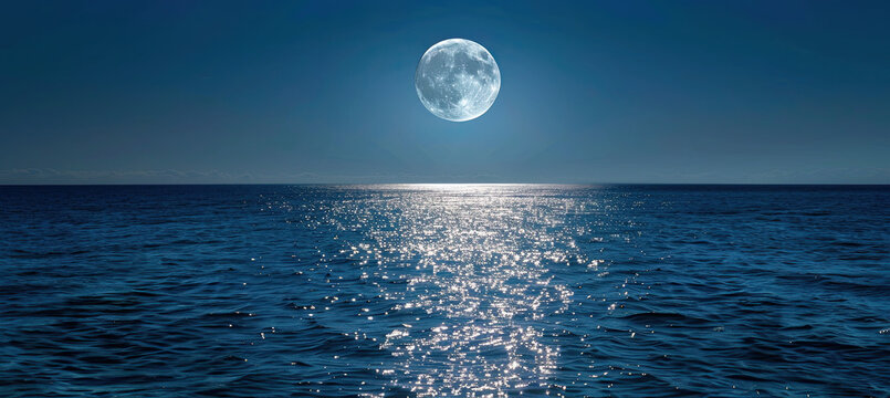 full moon rising over a calm ocean, casting a path of shimmering silver on the water surface. 
