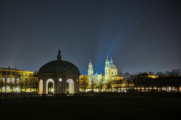 Dianatempel landmark and a cathedral on clear night sky background in Munich, Germany