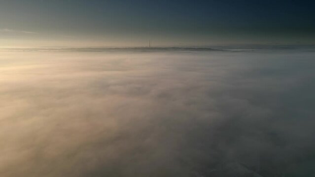 Aerial view over mist during daytime