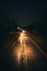 Vertical shot of an empty highway during a nighttime