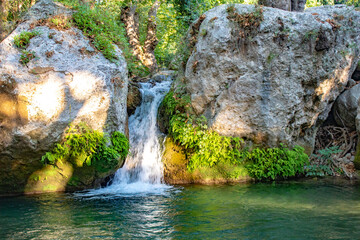 Small waterfall surrounded by big rocks