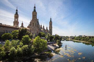 Fototapeta na wymiar Cathedral Basilica of Our Lady of the Pillar in Zaragoza, Spain, beside the river ebro