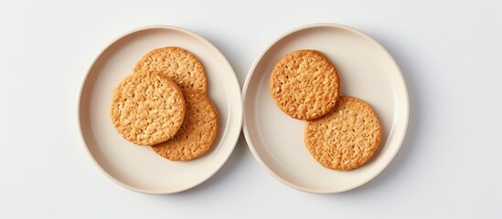 Two heart cookies on plates, oat crumble biscuits on grey plate flatlay - Powered by Adobe