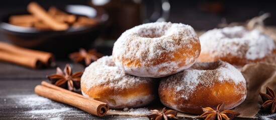 Pile of donuts with cinnamon and star anise - obrazy, fototapety, plakaty