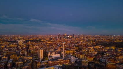 Fototapeta na wymiar Cityscape from drone of Milan at sunset. Copy space.
