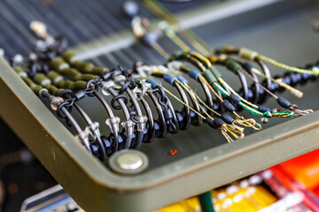 Carpfishing session at the Lake.Carp fishing hooks.fishing hooks are equipped with leashes for...