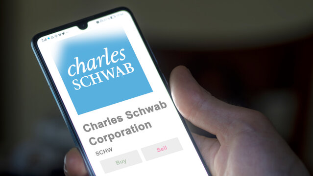April 09th 2024 , Westlake, Texas. Close up on logo of Charles Schwab Corporation on the screen of an exchange. Charles Schwab Corporation price stocks, $SCHW on a device.