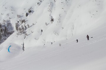Skier riding snowkite at the mountain pass in Simplon, Switzerland