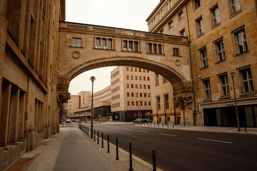 The elegant stone bridge connecting two buildings over a quiet city street