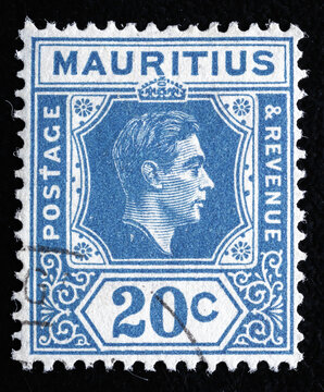 Ukraine, Kiyiv - February 3, 2024.Postage stamps from MAURITIUS..A stamp printed in MAURITIUS shows image of the King George VI , circa 1940.Philately.