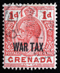 Ukraine, Kiyiv - February 3, 2024.Postage stamps from Grenada.An 1 pence rose-red postage stamp depicting a portrait of King George V. Grenada is an island country in the Caribbean Sea .Philately.