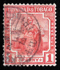 Ukraine, Kiyiv - February 3, 2024.Postage stamps from TRINIDAD AND TOBAGO.A stamp printed in Trinidad and Tobago shows female figure - symbol of Britain, circa 1917.Philately.