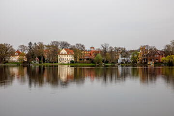Fototapeta na wymiar Calm view of lake water and shore with houses in Potsdam, Germany.