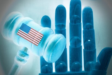 Robotic hand with wooden gavel. Concept of regulation of artificial intelligence in United States.