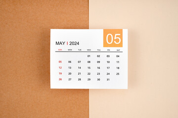 May 2024 calendar page on yellow.