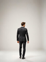 Back side of a young businessman