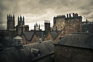 View of classic medieval roofs and chimney tops of the city of Edinburgh, Scotland.