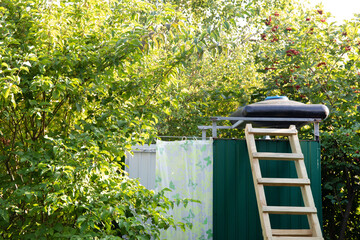 Open air outdoor garden shower cabin made of metal shits