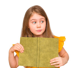Pretty little girl holding a book looking aside isolated over white background. Mockup child with diary.
