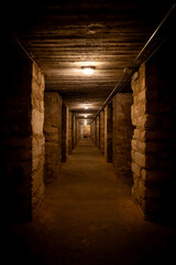 Dark hallway of former civil war bunker - obrazy, fototapety, plakaty