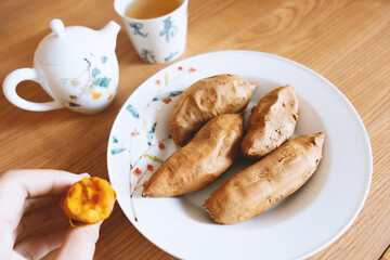 Chinese afternoon tea, good tea with roasted sweet potatoes, teapots and tea sets, carries the profound essence of Chinese tea culture, integrates practicality and artistry, and has a wide range 