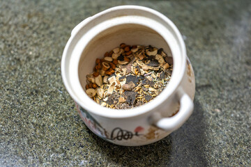 Chinese medicinal materials. Chinese people like to use Chinese medicine to treat diseases. Chinese medicine is combined with Western medicine. Special ceramic pots are used to cook medicine.