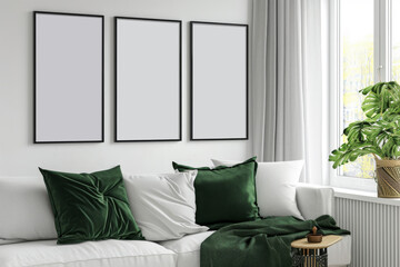 Empty poster frames gallery wall mock up. White and green living room
