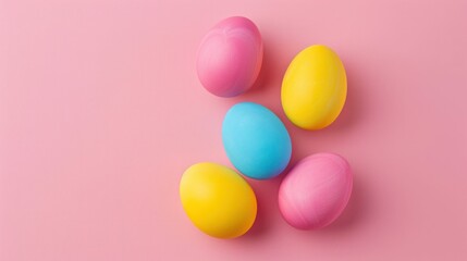 Fototapeta na wymiar Vibrant Easter Eggs Arranged on Pink Background with Copy Space, Top View and Flat Lay Concept