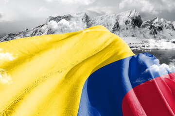 Colombia national flag cloth fabric waving on beautiful ice Mountain Background.