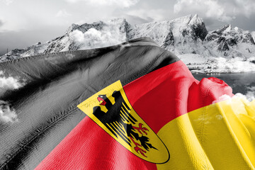 Germany  national flag cloth fabric waving on beautiful ice Mountain Background.