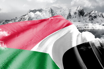 Sudan national flag cloth fabric waving on beautiful ice Mountain Background.