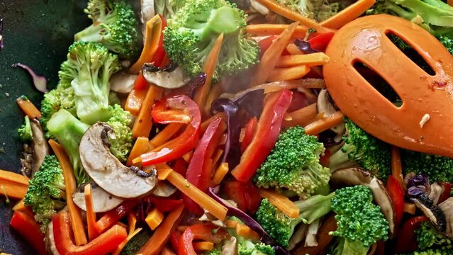 Burst Of Colors And Tastes - Stir-Fried Veggies Linger In The Wok During Final Moments Of Cooking, Unveiling Amazing Scents With The Rising Steam