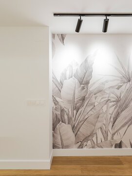 Modern room with tropical wallpaper and track lighting