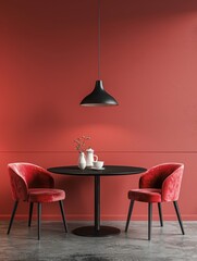 A simple yet striking red dining scene featuring a round black table, two matching red velvet chairs, and a single pendant light casting a warm glow.