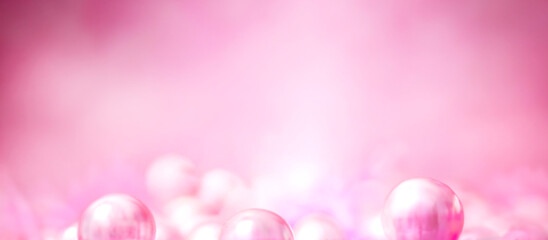 ピンク色の球体とぼやけたコピースペース背景
