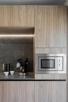 Modern kitchen with built-in appliances and espresso machine