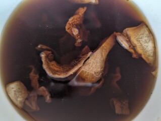 Mushrooms placed in water for hydration