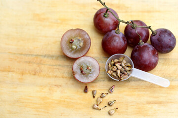 grape seeds and grapes isolated on white background, grape seeds for herbal alternative medicine and beauty ingredients