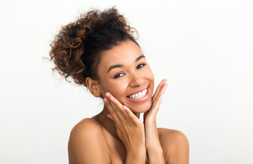 African-american woman without make-up on light background