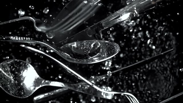 Super slow motion cutlery falls. High quality FullHD footage
