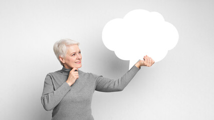 Elderly lady with a speech bubble cloud