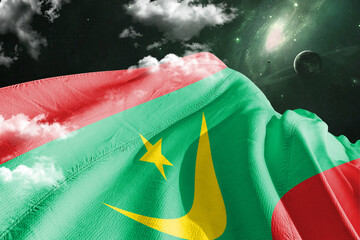 Mauritania national flag cloth fabric waving on beautiful Green galaxy Background.