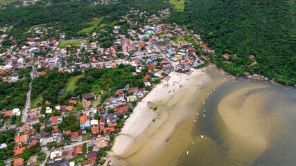 Fototapeta premium Guarda do Embaú Beach located in the state of Santa Catarina near Florianopolis. Aerial image of beach in Brazil