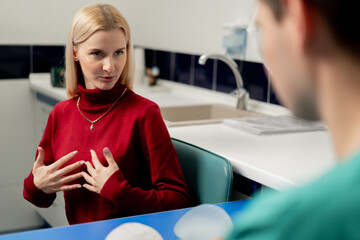 in a plastic surgery clinic a young girl is consulted for breast augmentation