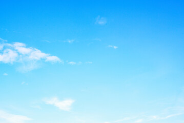 Expansive blue sky with delicate wispy clouds, conveying a sense of calmness and serenity..