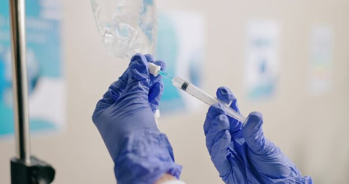 Hospital, IV drip and hands of doctor with syringe for medicine, infusion and medication for patient. Healthcare, clinic and closeup of person with liquid for treatment, vitamins and antibiotics