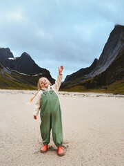 Child girl traveling in Lofoten island walking on the beach family vacations outdoor, girl 4 years old kid exploring Norway active healthy lifestyle, adventure trip - 781304726