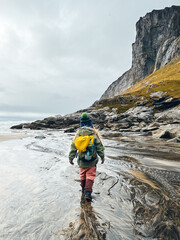 Child girl hiking in Norway travel family active vacations outdoor healthy lifestyle 4 years old kid with backpack exploring Lofoten islands - 781309707